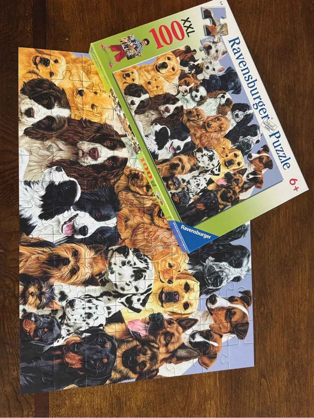 EUC Ravensburger 100-piece puzzle featuring various dog breeds - Fun!
